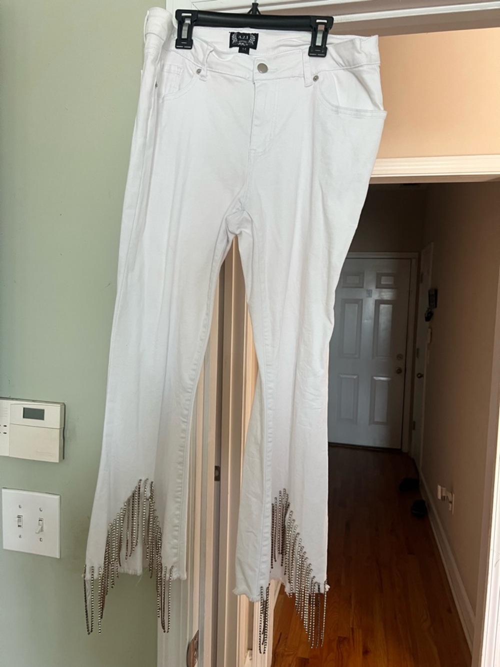 AZI White Flare Jeans with Chain Fringe from Willow Tree Boutique.